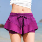 "Purple quick-drying sports shorts front view"