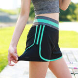 Lightweight quick-drying sports shorts in purple front view