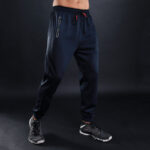 Grey men’s sports fitness trousers made of polyester